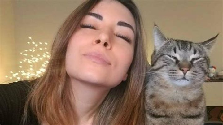 Alinity Divine Alinity Divine feeding her cat some Vodka